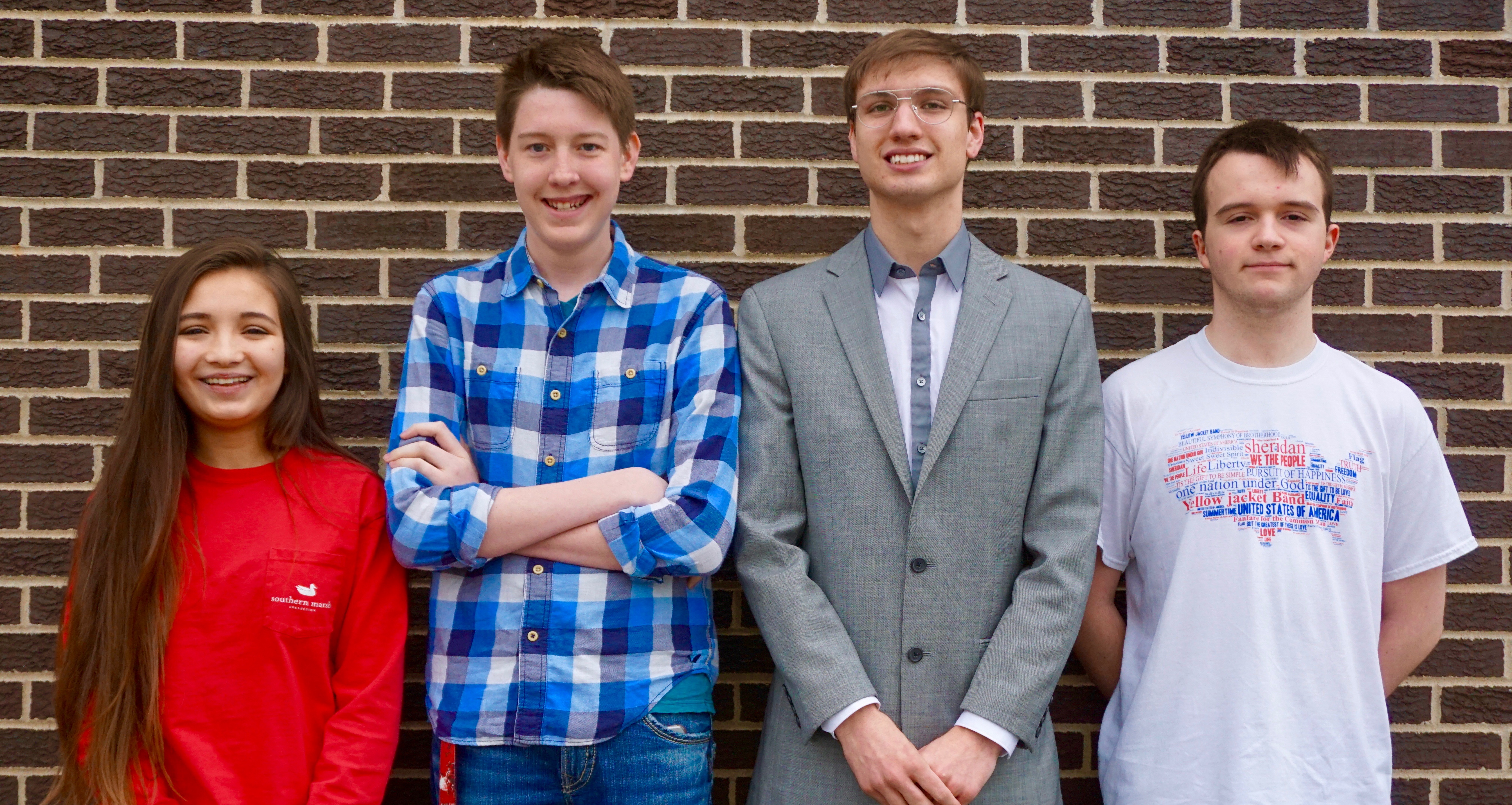 Four debate team members posing for picture