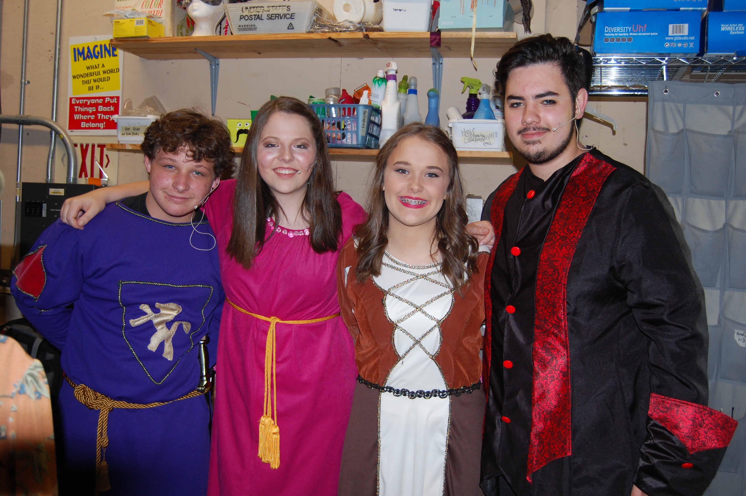 Students smiling backstage before performing in Camelot